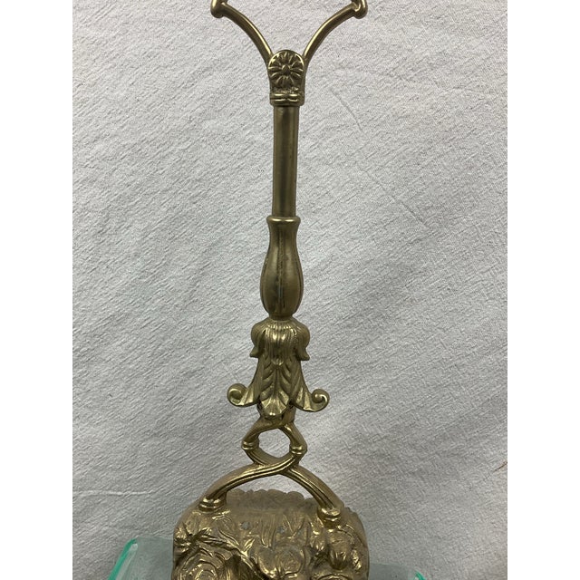Victorian era tall brass doorstop with handle. Very clean casting of the ornate base featuring roses. The back side has a...