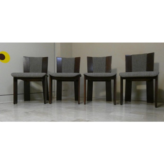 Set of four acerbis international wooden chairs upholstered in tweed. The seat is padded with rectangular wooden legs,...