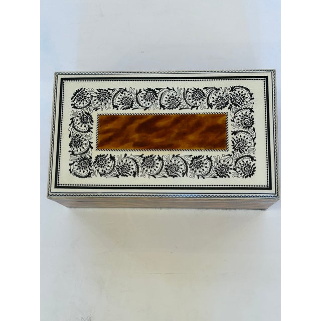 “Tawny Tortoise” is a one of a kind hand painted box created by Princeton artist Karen Guarriello, who learned her mastery...