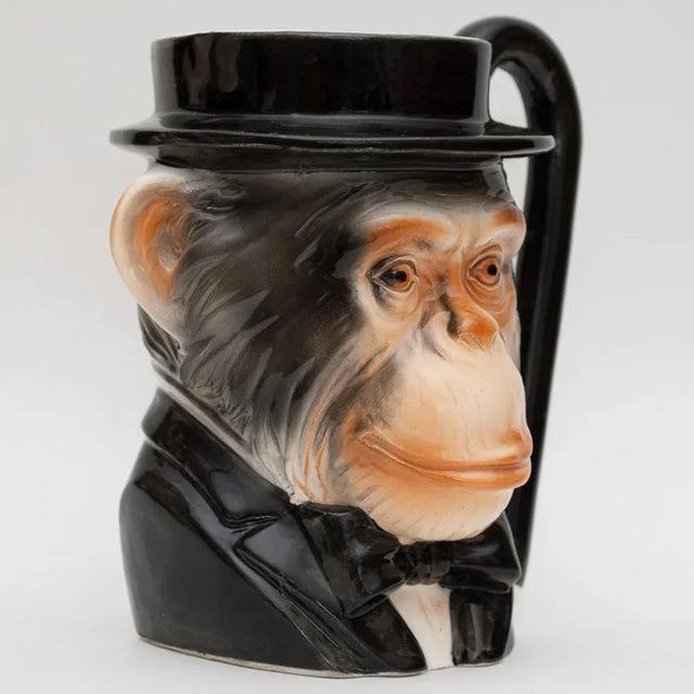 Rare superb vintage English porcelain collectable mug in a shape of head of a chimpanzee wearing tux and bowler hat. A...