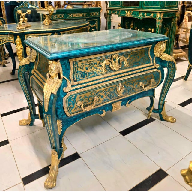 Experience the grandeur of French craftsmanship with this magnificent French Louis XV Bombe Commode, exquisitely finished...