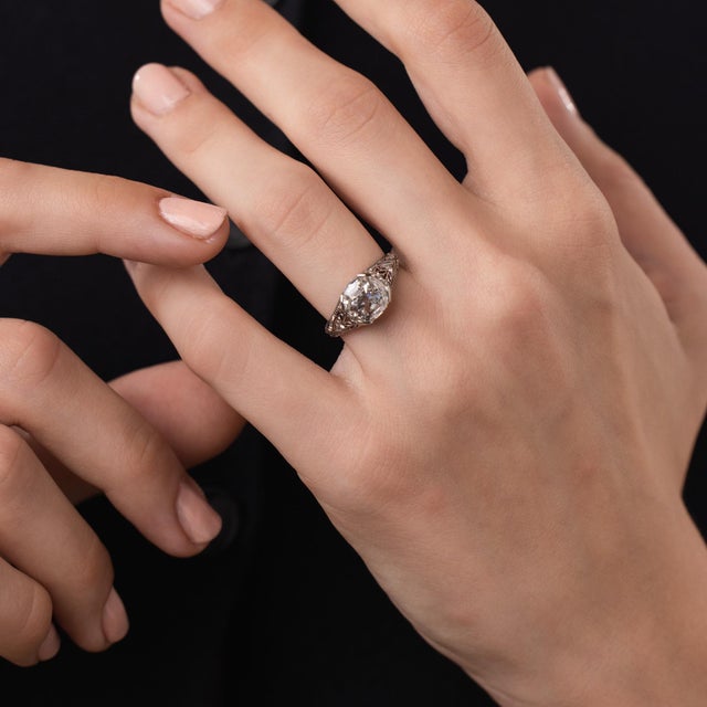 This beautiful Art Deco diamond engagement ring is a refined 1930’s design, centered by a GIA-certified cushion brilliant...