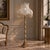 Make a dramatic statement with this ornate French-style floor lamp, featuring an intricately decorated gilded column and...