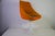 Orange tulip armchair in the style of Knoll, 1970s. This striking vintage chair features a sculptural upholstered shell...