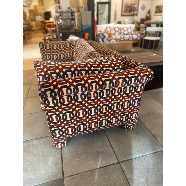 Geometric mid- century modern two seater sofa, full upholstered eye catching woven textile, repeating interlocking chain...