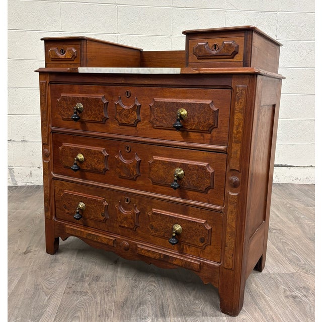 This is a stunning antique Victorian Eastlake burled wood gentleman's dresser or commode with marble inlay, dovetailed...