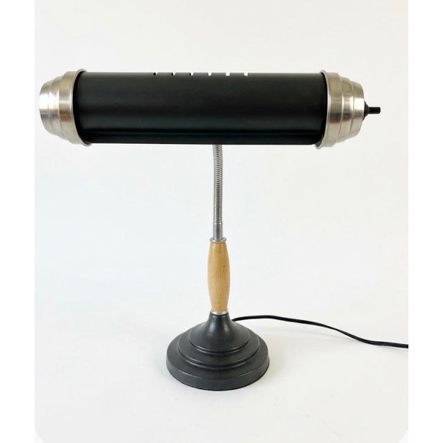 Elevate your workspace or task area with this striking Mid-Century Modern tubular desk lamp. Featuring a sleek,...
