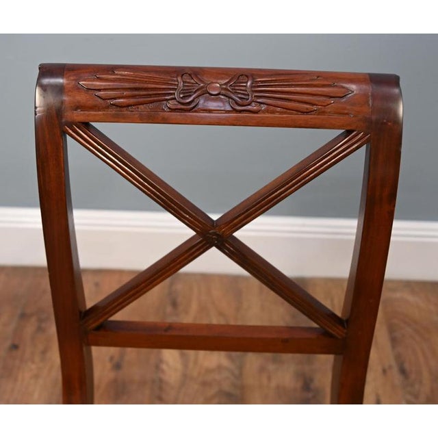 Elegant Regency style mahogany window seat or bench Curved scroll ends with carved anthemion and classical detailing Cane...