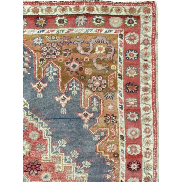 An antique Turkish Oushak carpet from the first quarter of the 20th century. Measures: 3' 6" x 5' 1"