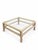 A charming late-20th-century square coffee table featuring a woven wicker and rattan frame with an inset clear glass top....