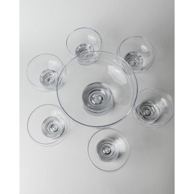 This set of 6 vintage drinking glasses and 1 bigger Bowl, designed by Vicke Lindstrand for Kosta Boda, hails from the...