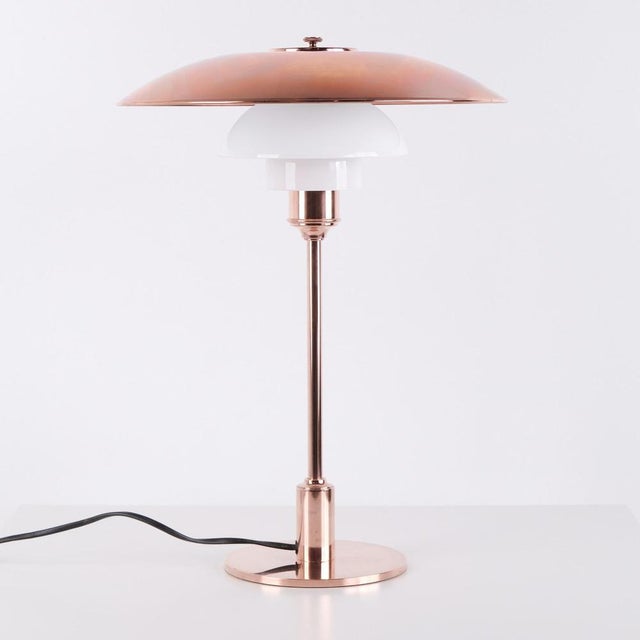Ph table lamp model ph 3½-2½ limited edition designed by poul henningsen and manufactured by louis poulsen. The lamp is...