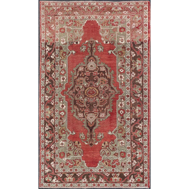 Measures: 6'2 x 10'3. Antique Turkish Oushak Carpet with Medallion in Soft Red, Green and Brown. Keivan Woven Arts...
