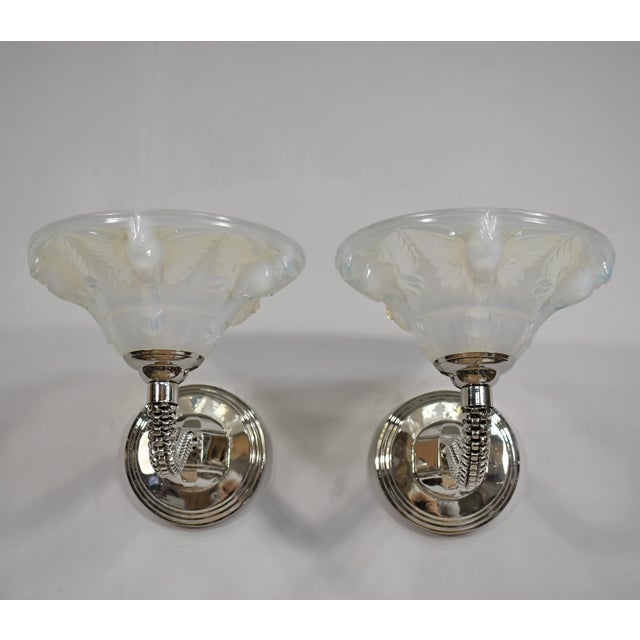 JEAN BORIS LACROIX A beautiful pair of French art deco double wall sconces around 1935-1940 in nickel-plated solid brass...