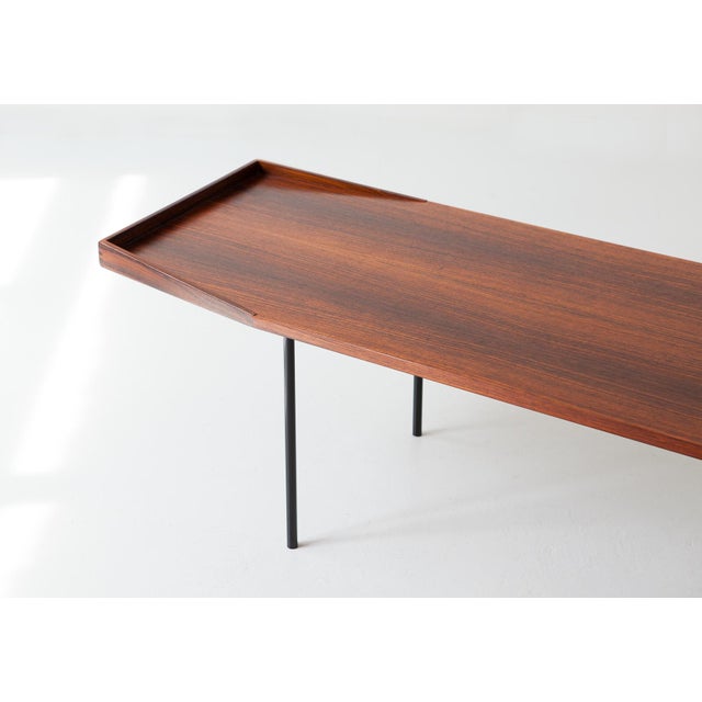 A low and large table manufactured in Italy during the 1950s As we normally prefer, the original finish has been...