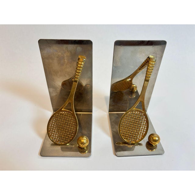 Pair of Vintage Brass and Chrome Tennis Racket and Ball Bookends, USA, circa 1980s Add a touch of sporty sophistication to...