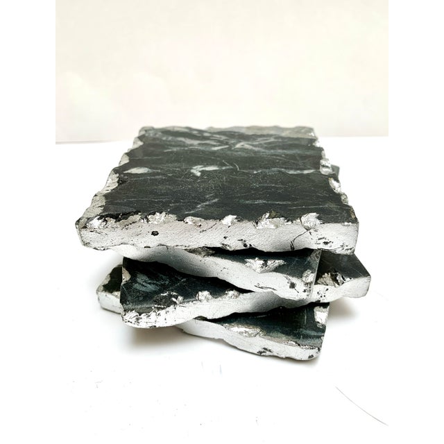 Silver edged square black stone marbleized with gray vein like natural marks. Set of four rustic elegant coasters for any...