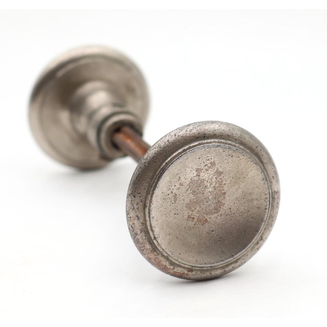 Vintage Art Deco style door knob set made of brass with a nickel finish. The knob has a concave center. Priced as two door...