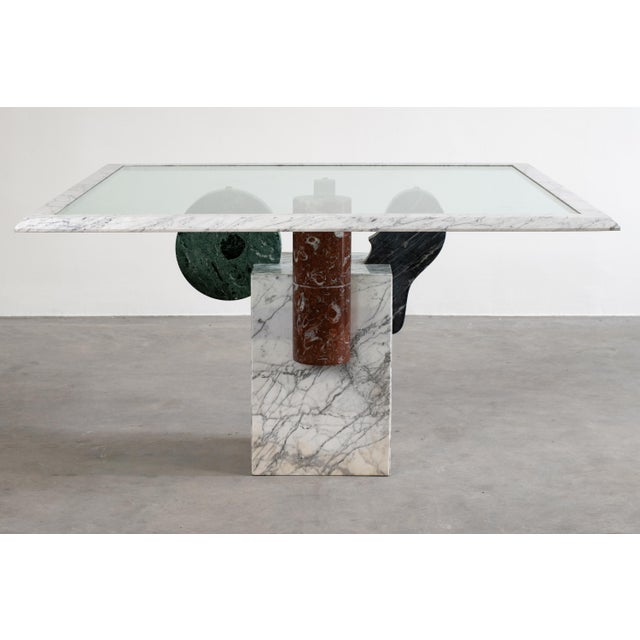 Square Brugiana table with a base in white Carrara marble and geometric elements in arabescato, green Alpi, sandstone, and...