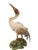 Jay Strongwater signed crane statue standing atop a lily pad base, hand-enameled with intricate feather texture and...