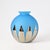 Spherical vase made of blue glass with a matte finish. Decorated with elongated, pointed silver mirror-like motifs.