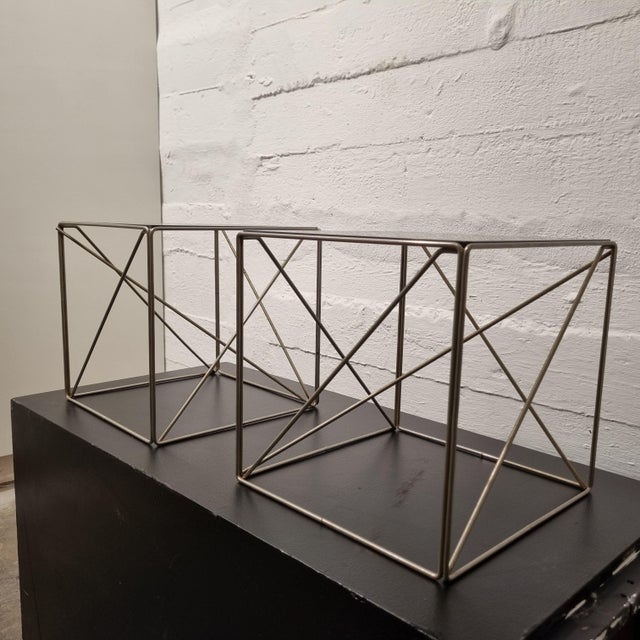 Side tables, designed by max sauze for isocèle editions in the 70s. Gold metal and smoked glass tray. Geometric lines for...