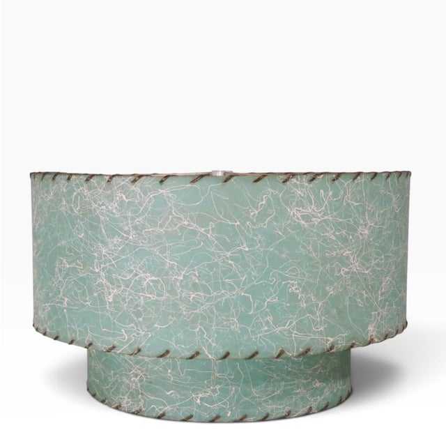 Classic Mid century twon tier fiberglass shade having a turquoise ground with white wandering line decoration. This 1950's...
