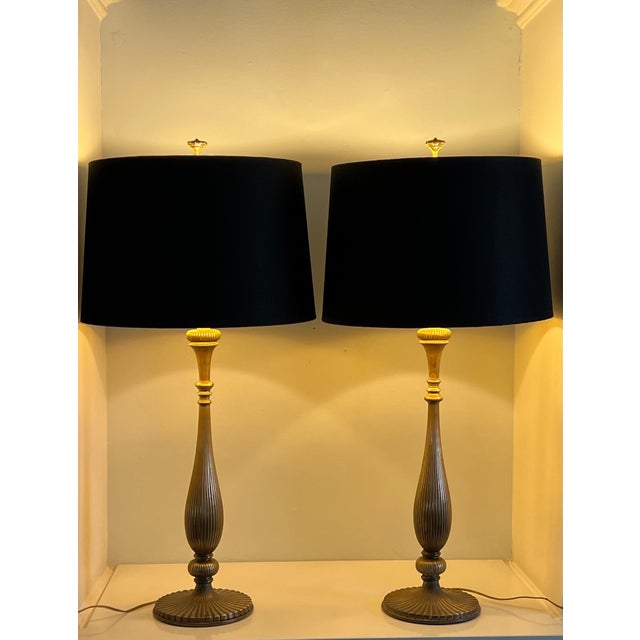 A wonderful pair of brass Chapman lamps. Iconic mid century lamps with a ribbed brass candlestick style body. Quite...