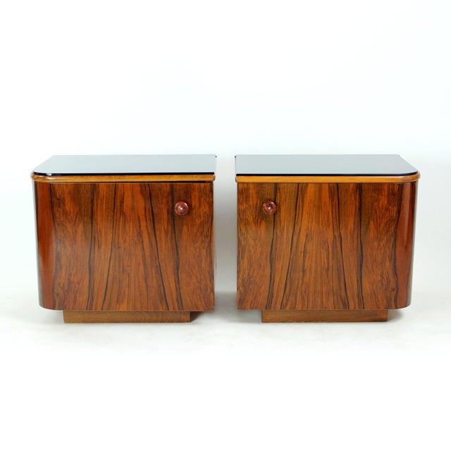 Beautiful and distinctive pair of bedside tables dating from the 1940s, showcasing the elegant transition from Art Deco to...