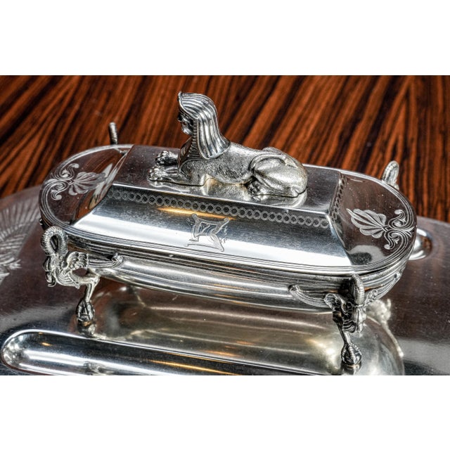 An exceptional and visually commanding circa 1870 Victorian silverplate inkstand, this piece exemplifies the height of...