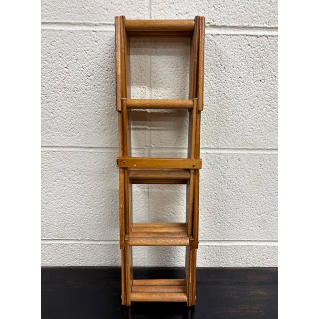 This is a vintage expanding wooden folding accordion wine rack. It holds 8 bottles. Dimensions: - 3 in wide closed - 18.25...