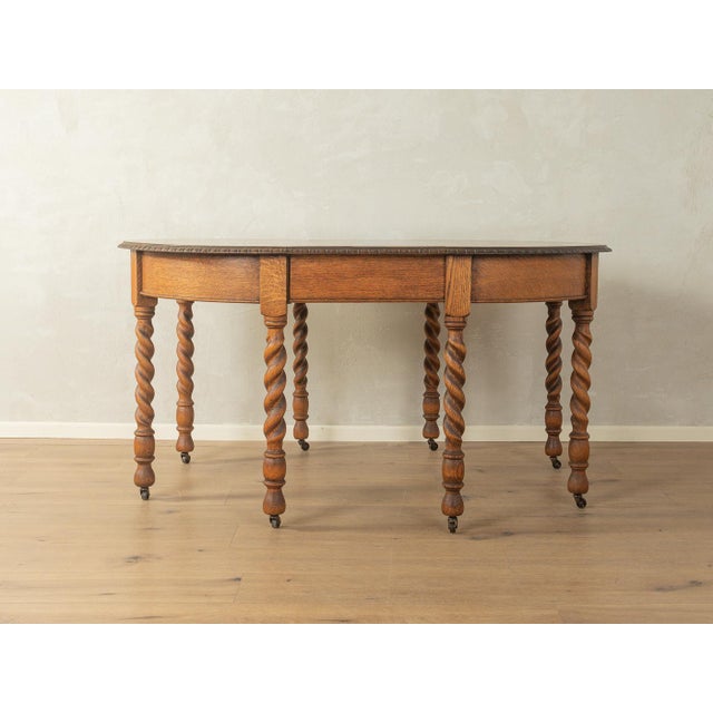 Classic Victorian dining table, circa 1840. High-quality solid oak frame with two extension leaves and eight turned spiral...