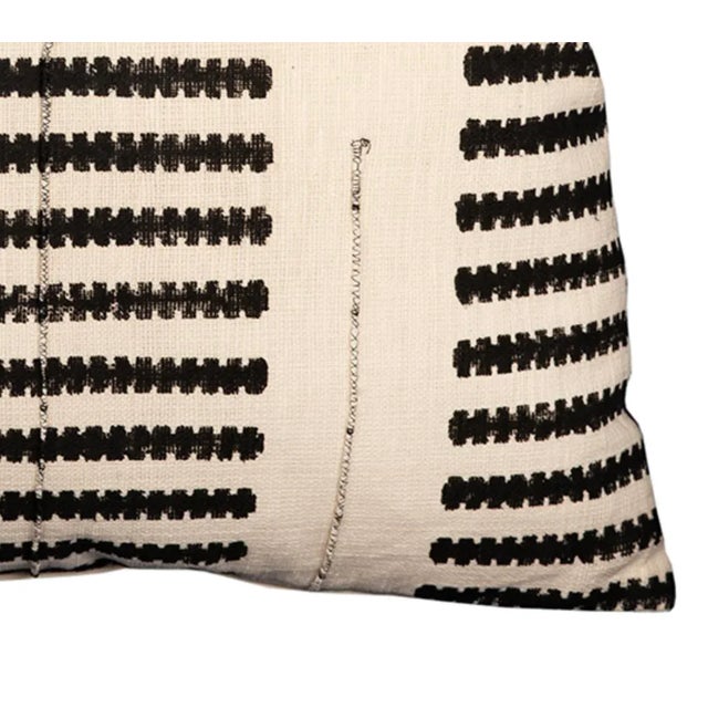 Hand woven cotton pillow with traditional Indian block print method black stripe patterning. Comfy poly fill. Each...