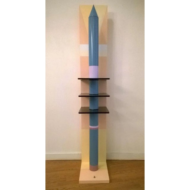 A sculptural rocket shaped floor lamp done in a purple and blue lacquered metal rocket with three smoked glass trays, a...