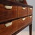 Cabinet with drawers and an open shelf, in clear glass. Made of solid stained beech wood and exotic wood veneer, with...