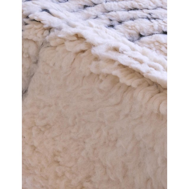 Elevate your space with our Moroccan Textured Beni Ourain Rug. Measuring at 9.5 x 4.4 ft, this white runner size rug adds...