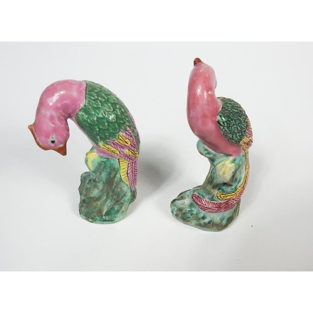 Pair of small Chinese export porcelain birds in pink and green glaze. Slightly different poses and color variation, larger...