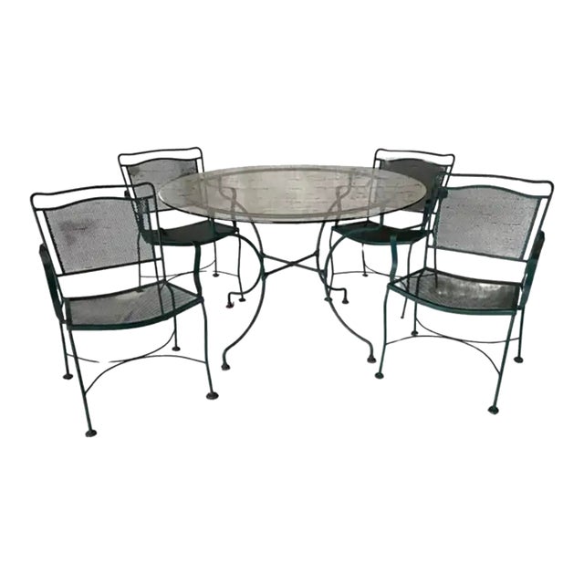 Wrought Iron Patio Table and Four Chairs, a Five Piece Set For Sale