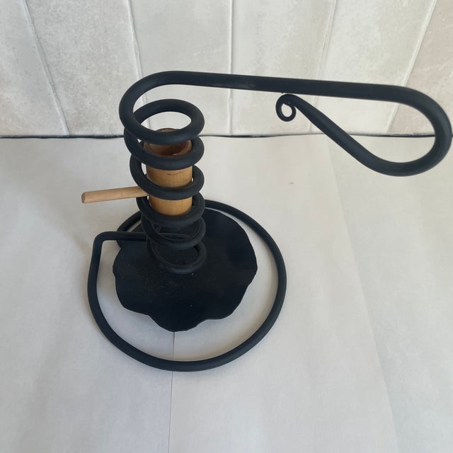Hand forged iron “courting” candlestick. Parents could set the time allowed for men to visit with their girlfriends by...