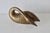 1970s Vintage brass swan sculpture, featuring intricate feather detailing on its wings and a graceful, curved neck. Eight...