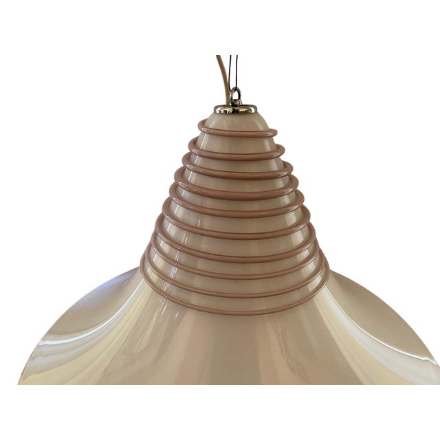 Stunning pair of Vistosi Murano Glass satellite pendant lights. White Glass with pink swirl on top as well around the...