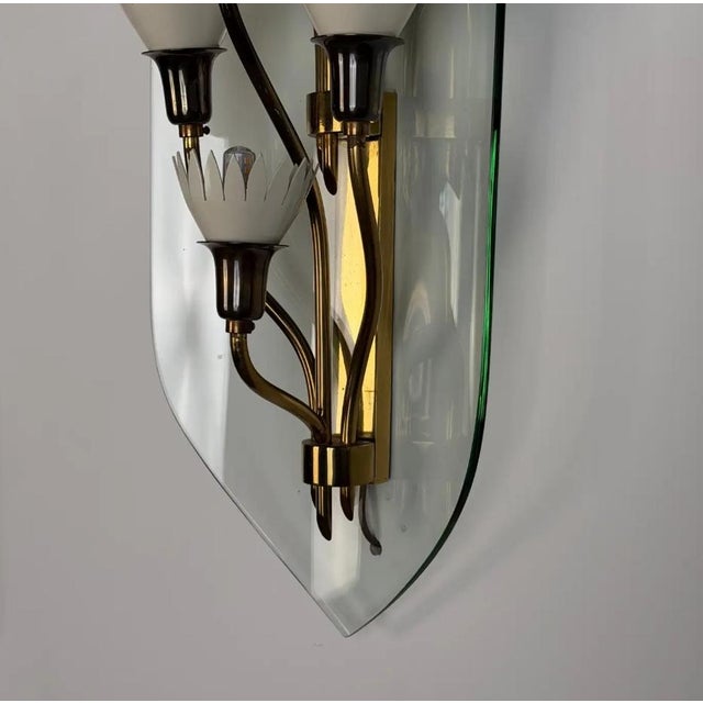 These striking architectural appliques perfectly embody the poetic modernism and material sophistication that defined...
