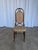 Wooden dining chair made in the Thonet style in Yugoslavia during the 1970s. The chair features a tall backrest with a...