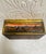 This is a beautiful gold guilt wooden box that has reverse painted glass surrounding it. That is done in the style of van...
