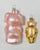 Pair of vintage German glass Christmas ornaments featuring a cheerful pink pig and a golden teddy bear. The oversized pig...