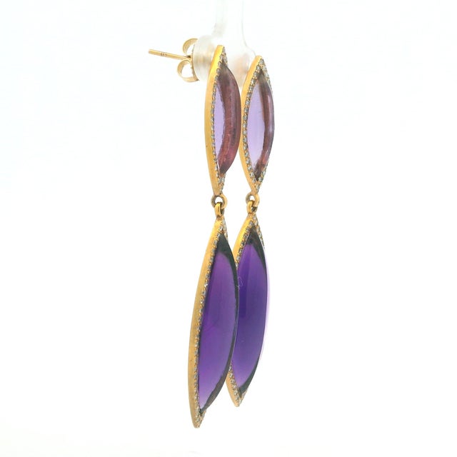 These elegant Italian drop earrings are handcrafted in 14 karat yellow gold and feature four beautifully matched...