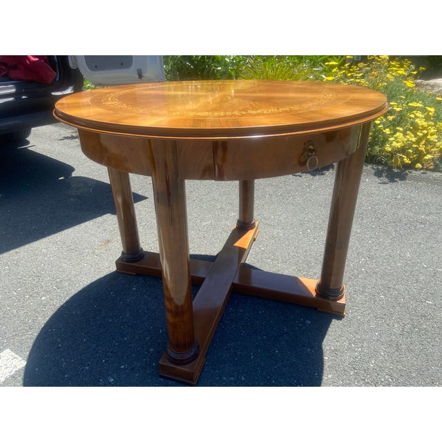 The Vintage French Empire Round Table is a stunning piece of furniture that exudes elegance and sophistication. This fully...