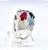 This spectacular multi-gemstone cocktail ring is a vibrant celebration of color set in gleaming white gold. A bold carved...