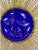 Mid-century wall plaque crafted as a sun composed of a cobalt blue glass face at the center set into a gilt iron mount of...