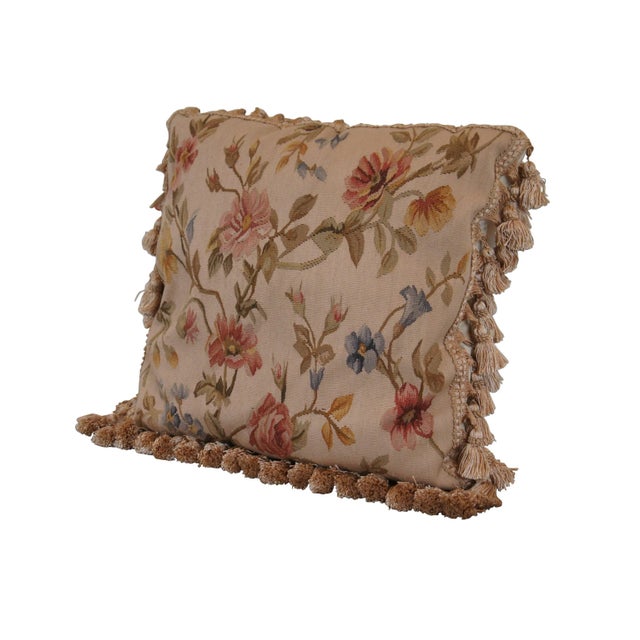 20th century square floral throw pillow, embroidered in wool with blue, pink, and yellow flowers on green-brown branches....